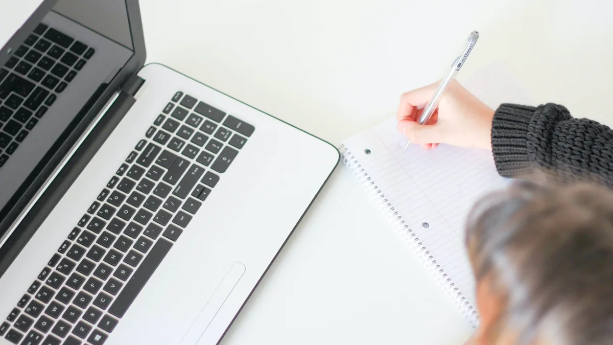 Laptop and notebook on a desk in a home office