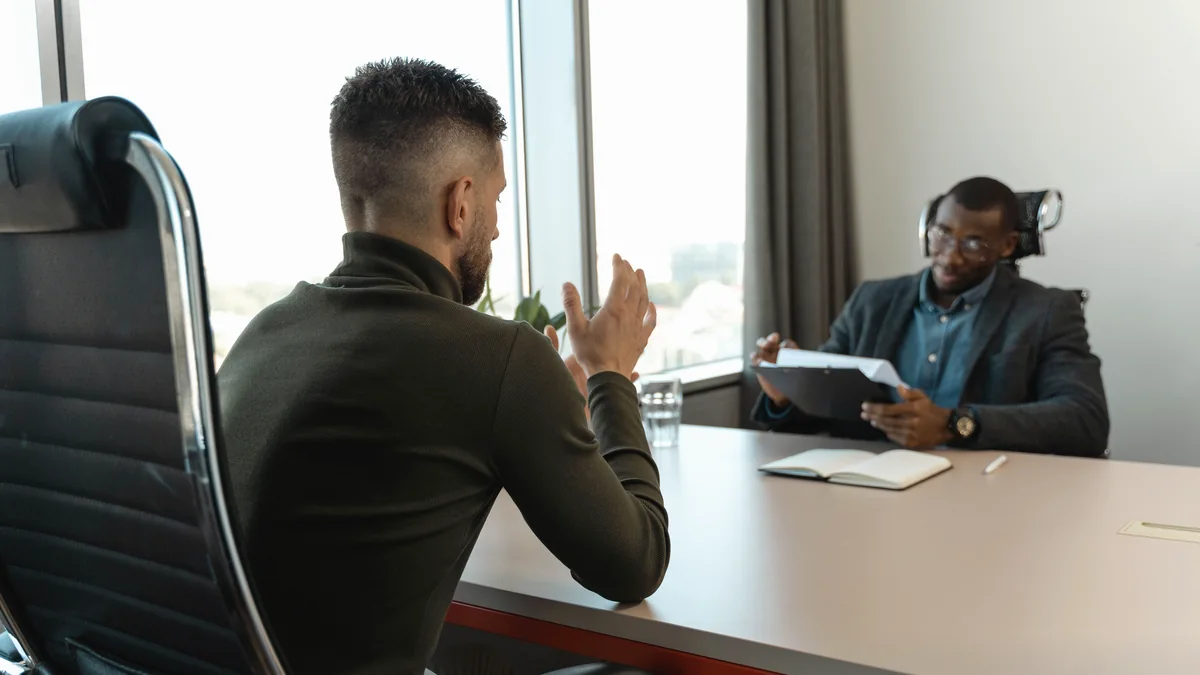 Two men in a job interview in a modern office