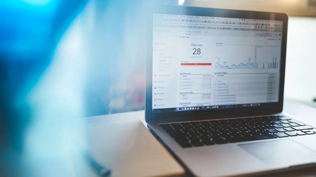 Laptop displaying Google Analytics in a modern workspace