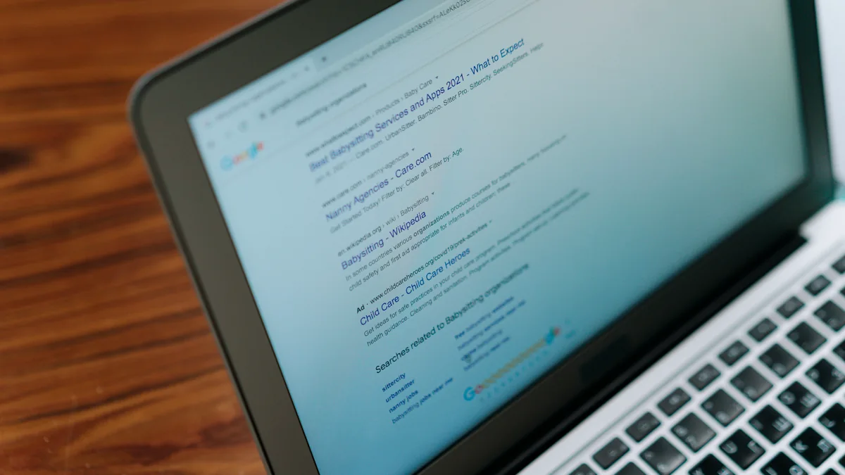 Close-up of a laptop screen showing a search engine page