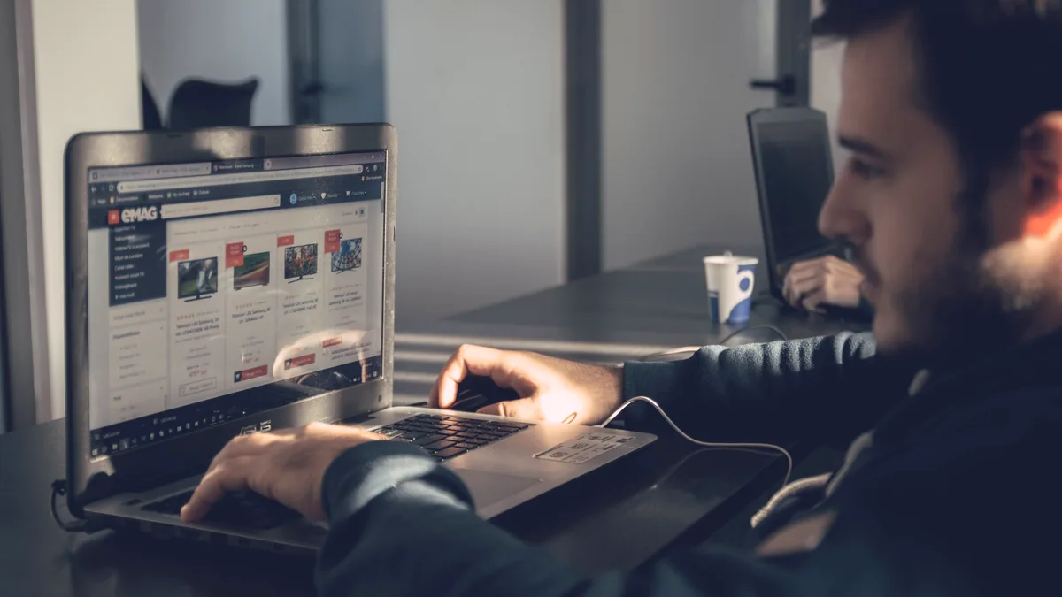 Man using a laptop to browse online